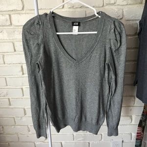 EUC sweater vest with subtle shoulder puff.